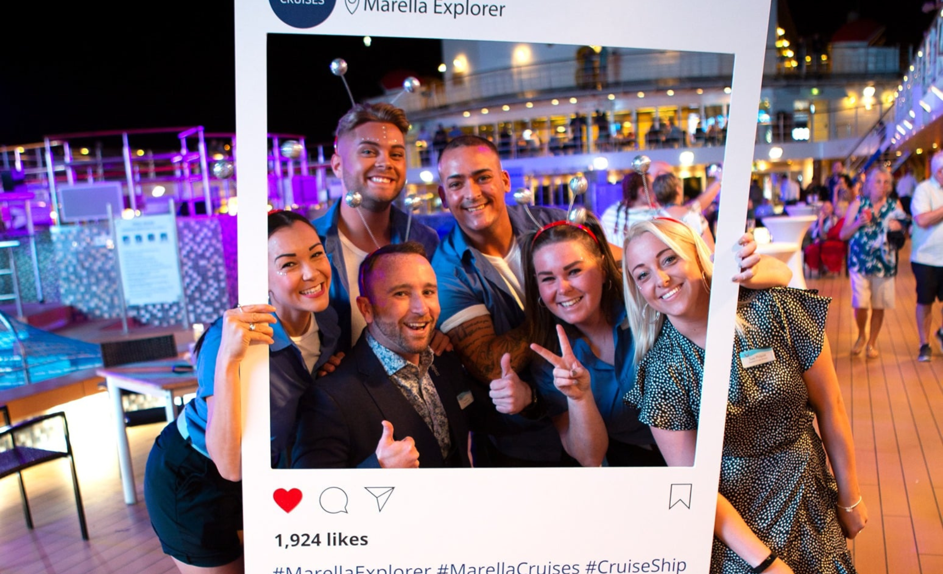 A group of entertainment team members photographed in an Instagram frame